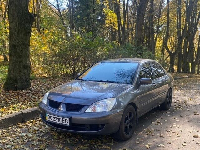 Сірий Міцубісі Lancer, об'ємом двигуна 1.58 л та пробігом 240 тис. км за 2500 $, фото 1 на Automoto.ua