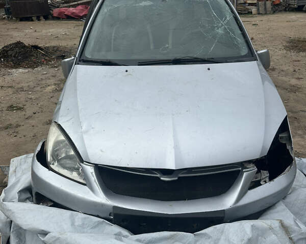 Сірий Міцубісі Lancer, об'ємом двигуна 1.58 л та пробігом 210 тис. км за 1300 $, фото 1 на Automoto.ua