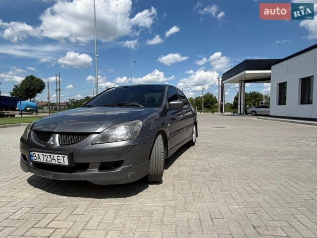 Сірий Міцубісі Lancer, об'ємом двигуна 2 л та пробігом 297 тис. км за 4300 $, фото 1 на Automoto.ua