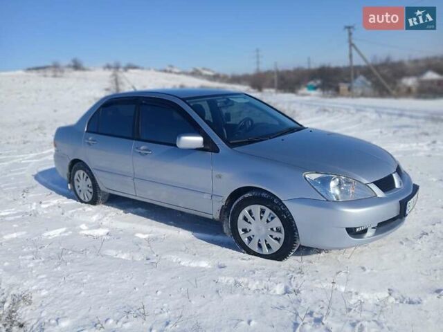 Серый Мицубиси Лансер, объемом двигателя 1.6 л и пробегом 277 тыс. км за 4599 $, фото 1 на Automoto.ua