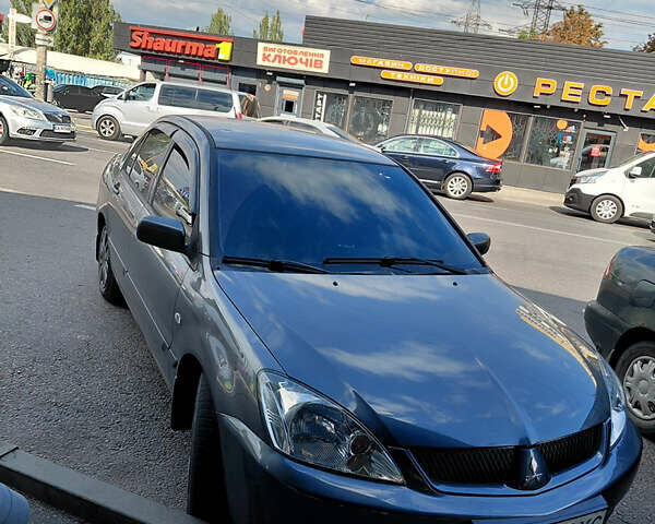 Сірий Міцубісі Lancer, об'ємом двигуна 1.58 л та пробігом 242 тис. км за 3600 $, фото 1 на Automoto.ua