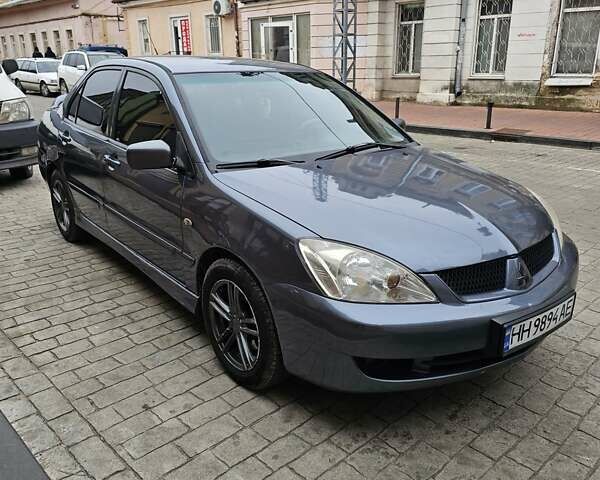 Серый Мицубиси Лансер, объемом двигателя 1.58 л и пробегом 260 тыс. км за 3700 $, фото 1 на Automoto.ua