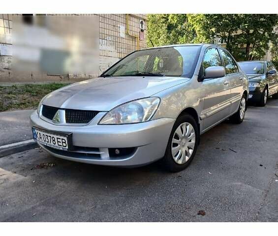 Серый Мицубиси Лансер, объемом двигателя 1.58 л и пробегом 170 тыс. км за 4600 $, фото 1 на Automoto.ua