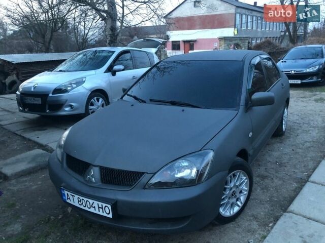 Серый Мицубиси Лансер, объемом двигателя 1.6 л и пробегом 350 тыс. км за 3888 $, фото 1 на Automoto.ua