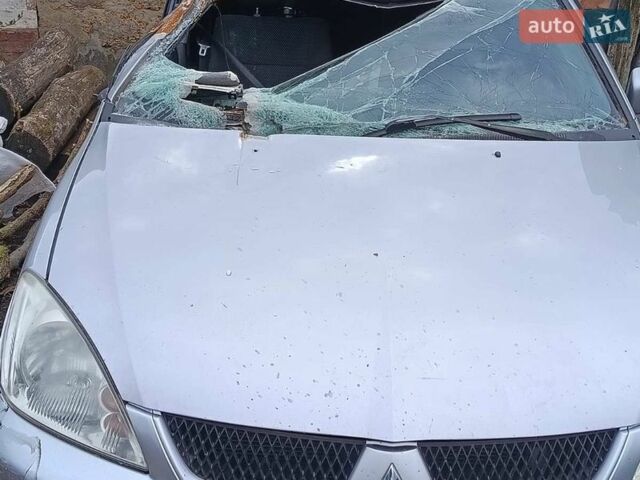 Серый Мицубиси Лансер, объемом двигателя 1.58 л и пробегом 159 тыс. км за 1800 $, фото 1 на Automoto.ua