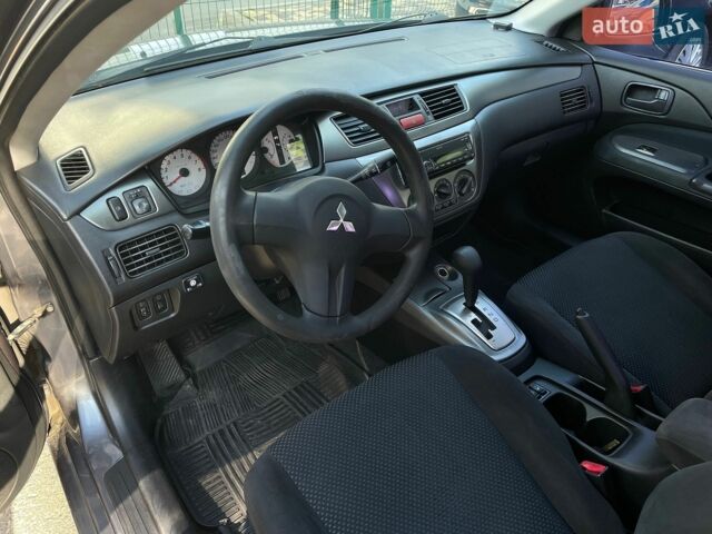 Сірий Міцубісі Lancer, об'ємом двигуна 1.58 л та пробігом 288 тис. км за 4300 $, фото 1 на Automoto.ua