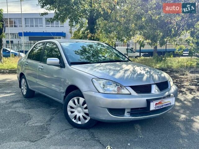 Сірий Міцубісі Lancer, об'ємом двигуна 1.58 л та пробігом 138 тис. км за 4990 $, фото 1 на Automoto.ua