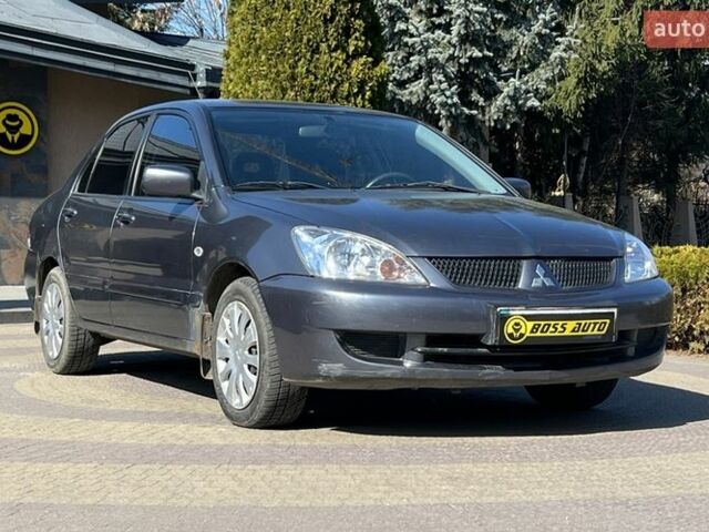 Серый Мицубиси Лансер, объемом двигателя 1.6 л и пробегом 139 тыс. км за 5600 $, фото 1 на Automoto.ua