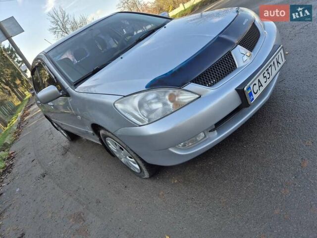 Сірий Міцубісі Lancer, об'ємом двигуна 1.58 л та пробігом 235 тис. км за 5200 $, фото 1 на Automoto.ua