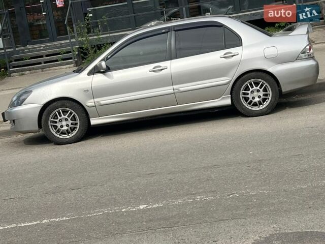 Серый Мицубиси Лансер, объемом двигателя 2 л и пробегом 235 тыс. км за 5100 $, фото 1 на Automoto.ua