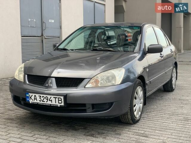 Серый Мицубиси Лансер, объемом двигателя 1.58 л и пробегом 225 тыс. км за 4200 $, фото 1 на Automoto.ua