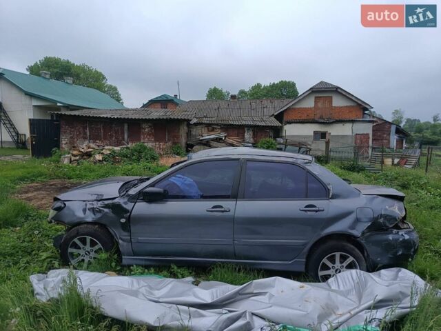 Серый Мицубиси Лансер, объемом двигателя 1.59 л и пробегом 350 тыс. км за 550 $, фото 1 на Automoto.ua