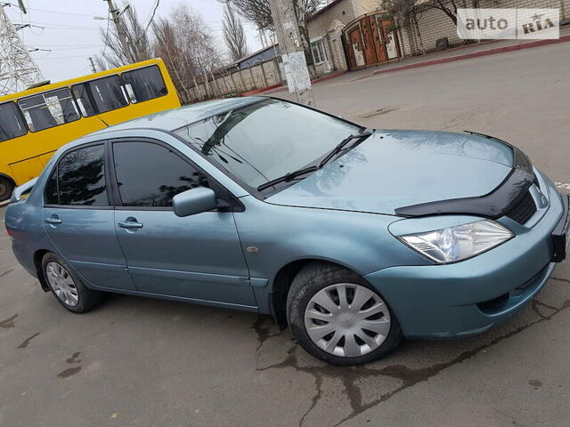 Сірий Міцубісі Lancer, об'ємом двигуна 1.6 л та пробігом 145 тис. км за 5500 $, фото 1 на Automoto.ua