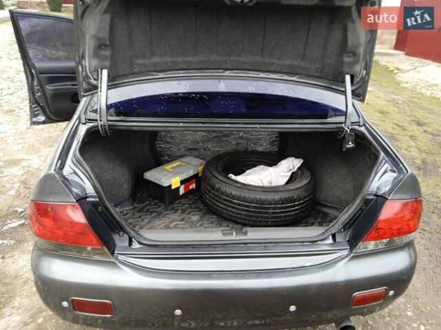 Сірий Міцубісі Lancer, об'ємом двигуна 1.6 л та пробігом 337 тис. км за 4600 $, фото 1 на Automoto.ua