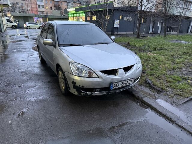 Серый Мицубиси Лансер, объемом двигателя 1.6 л и пробегом 218 тыс. км за 2800 $, фото 1 на Automoto.ua