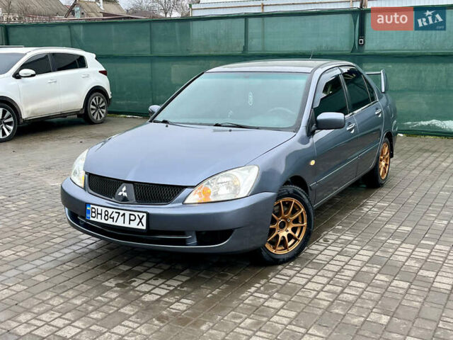 Серый Мицубиси Лансер, объемом двигателя 1.58 л и пробегом 156 тыс. км за 3950 $, фото 1 на Automoto.ua