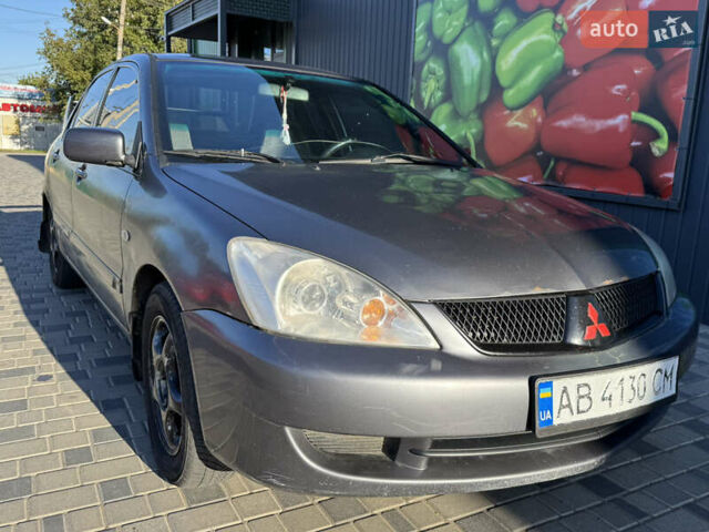 Сірий Міцубісі Lancer, об'ємом двигуна 1.58 л та пробігом 341 тис. км за 2200 $, фото 1 на Automoto.ua