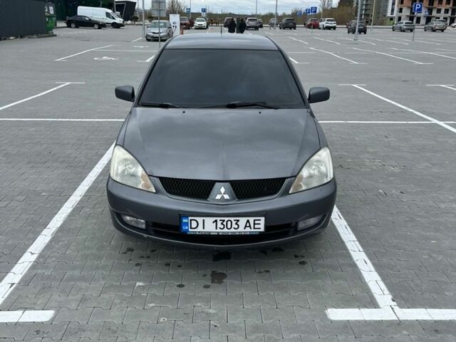 Сірий Міцубісі Lancer, об'ємом двигуна 1.6 л та пробігом 256 тис. км за 4200 $, фото 1 на Automoto.ua