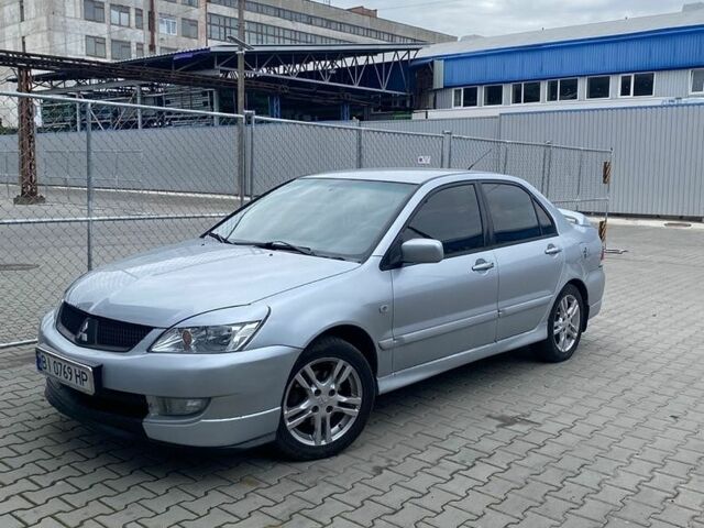 Сірий Міцубісі Lancer, об'ємом двигуна 1.58 л та пробігом 237 тис. км за 3050 $, фото 1 на Automoto.ua