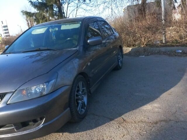 Серый Мицубиси Лансер, объемом двигателя 2 л и пробегом 180 тыс. км за 5000 $, фото 1 на Automoto.ua