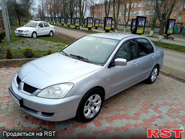 Серый Мицубиси Лансер, объемом двигателя 1.6 л и пробегом 200 тыс. км за 3750 $, фото 1 на Automoto.ua