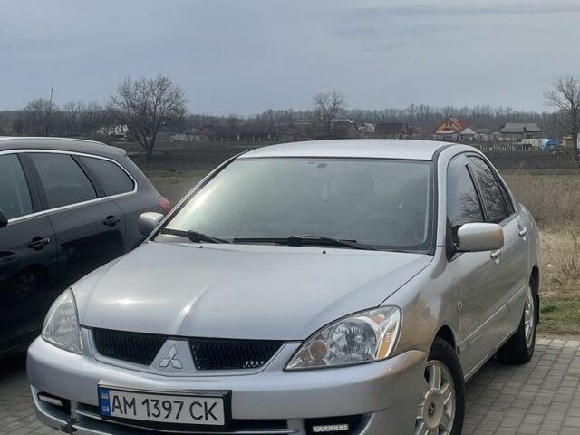 Серый Мицубиси Лансер, объемом двигателя 1.6 л и пробегом 206 тыс. км за 3399 $, фото 1 на Automoto.ua