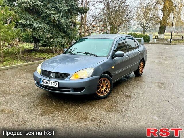Серый Мицубиси Лансер, объемом двигателя 1.6 л и пробегом 1560 тыс. км за 4200 $, фото 1 на Automoto.ua