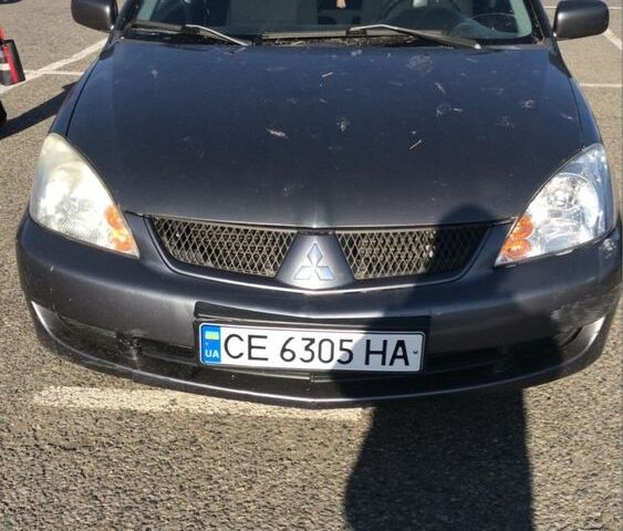 Серый Мицубиси Лансер, объемом двигателя 1.5 л и пробегом 269 тыс. км за 4200 $, фото 1 на Automoto.ua