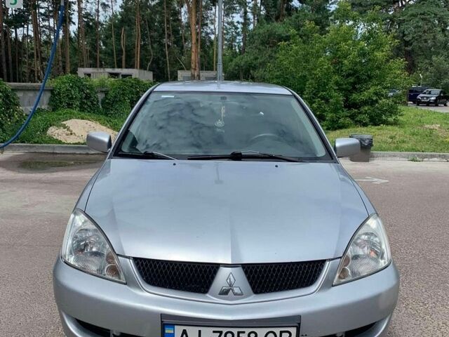 Сірий Міцубісі Lancer, об'ємом двигуна 1.58 л та пробігом 253 тис. км за 4100 $, фото 1 на Automoto.ua