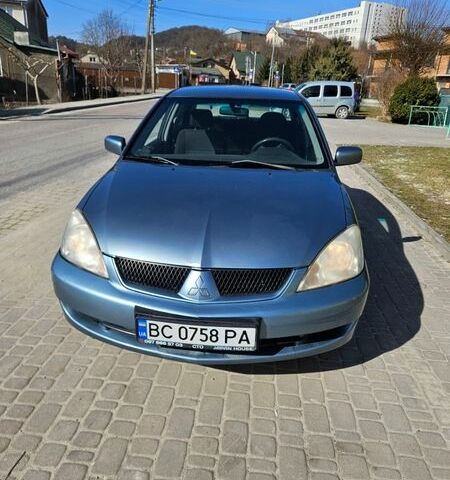 Серый Мицубиси Лансер, объемом двигателя 1.58 л и пробегом 190 тыс. км за 4500 $, фото 1 на Automoto.ua