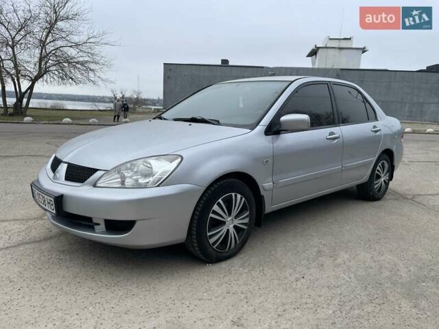 Сірий Міцубісі Lancer, об'ємом двигуна 1.59 л та пробігом 350 тис. км за 4000 $, фото 1 на Automoto.ua