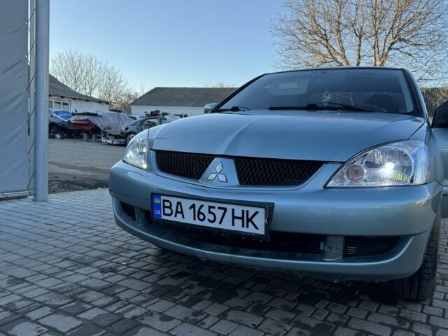 Серый Мицубиси Лансер, объемом двигателя 1.6 л и пробегом 242 тыс. км за 3800 $, фото 1 на Automoto.ua