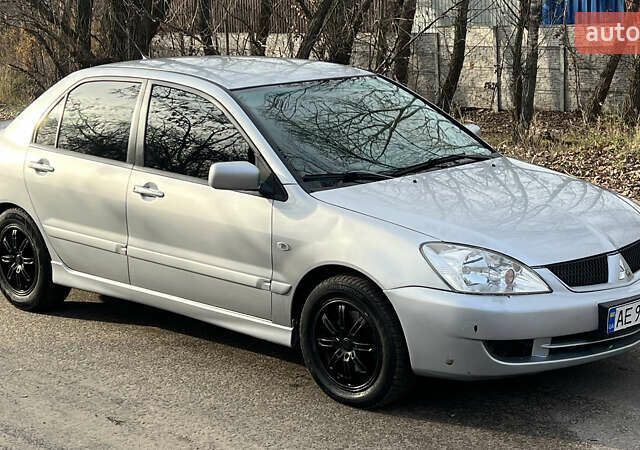 Серый Мицубиси Лансер, объемом двигателя 1.58 л и пробегом 290 тыс. км за 3750 $, фото 1 на Automoto.ua