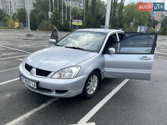 Серый Мицубиси Лансер, объемом двигателя 1.58 л и пробегом 232 тыс. км за 4900 $, фото 1 на Automoto.ua