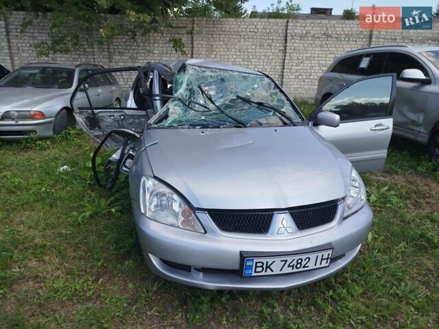 Серый Мицубиси Лансер, объемом двигателя 1.6 л и пробегом 270 тыс. км за 1100 $, фото 1 на Automoto.ua