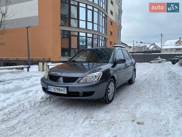 Серый Мицубиси Лансер, объемом двигателя 1.58 л и пробегом 170 тыс. км за 3999 $, фото 1 на Automoto.ua