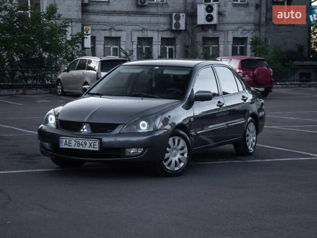 Серый Мицубиси Лансер, объемом двигателя 1.58 л и пробегом 283 тыс. км за 4600 $, фото 1 на Automoto.ua