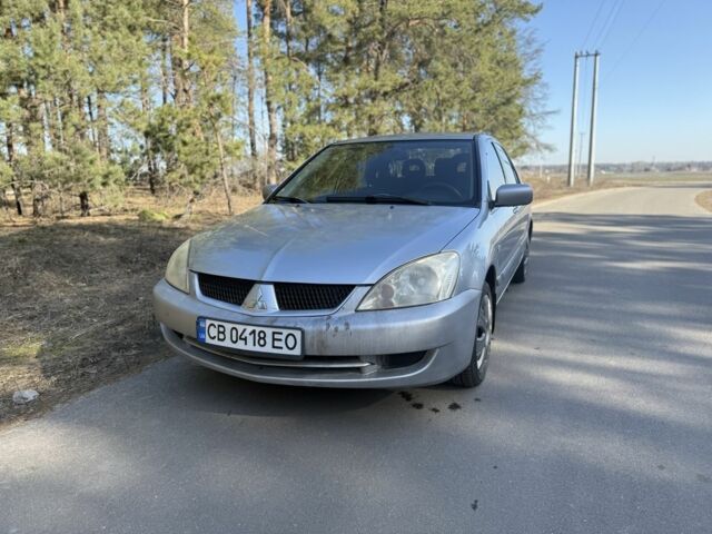 Серый Мицубиси Лансер, объемом двигателя 1.6 л и пробегом 259 тыс. км за 2750 $, фото 1 на Automoto.ua