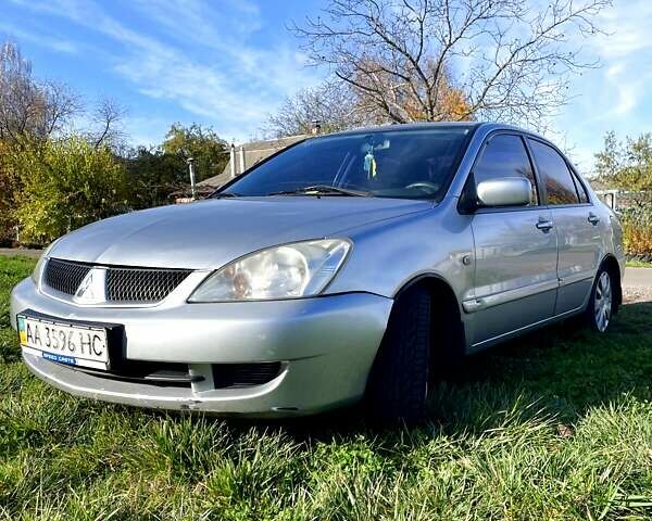 Сірий Міцубісі Lancer, об'ємом двигуна 1.6 л та пробігом 364 тис. км за 4300 $, фото 1 на Automoto.ua
