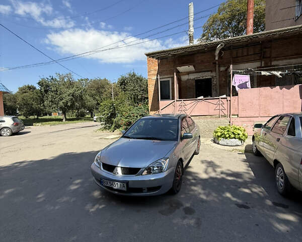 Сірий Міцубісі Lancer, об'ємом двигуна 1.6 л та пробігом 255 тис. км за 4100 $, фото 1 на Automoto.ua
