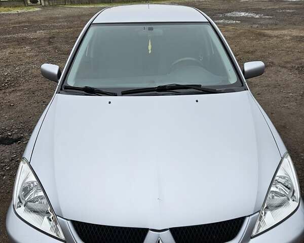 Сірий Міцубісі Lancer, об'ємом двигуна 1.58 л та пробігом 76 тис. км за 4500 $, фото 1 на Automoto.ua