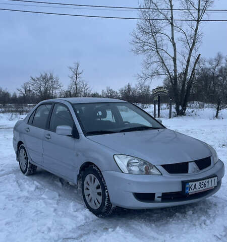 Серый Мицубиси Лансер, объемом двигателя 1.59 л и пробегом 313 тыс. км за 4000 $, фото 1 на Automoto.ua