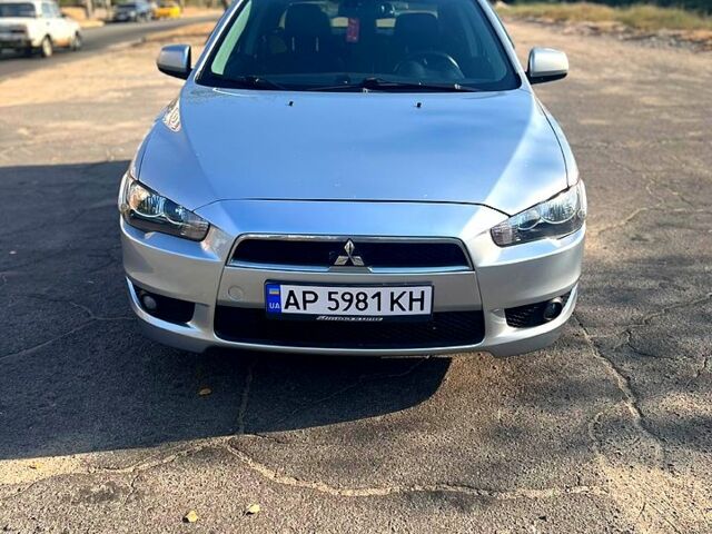 Серый Мицубиси Лансер, объемом двигателя 2 л и пробегом 151 тыс. км за 6099 $, фото 1 на Automoto.ua