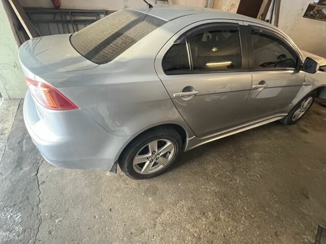 Серый Мицубиси Лансер, объемом двигателя 2 л и пробегом 175 тыс. км за 2000 $, фото 1 на Automoto.ua