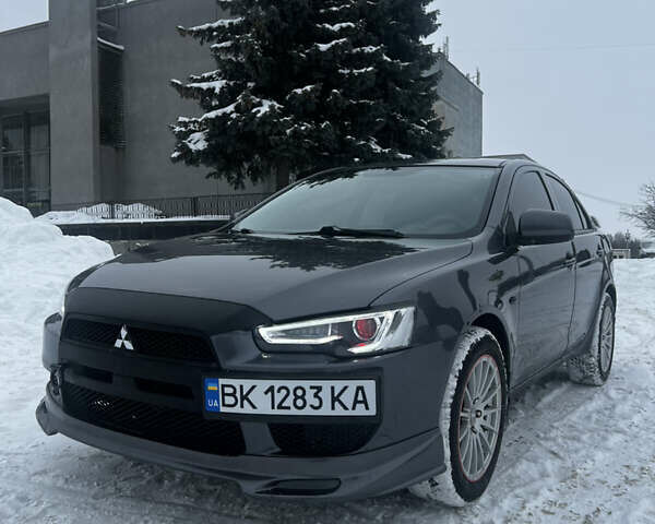 Серый Мицубиси Лансер, объемом двигателя 1.5 л и пробегом 206 тыс. км за 6399 $, фото 1 на Automoto.ua