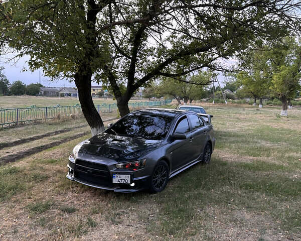 Серый Мицубиси Лансер, объемом двигателя 1.5 л и пробегом 255 тыс. км за 6000 $, фото 1 на Automoto.ua