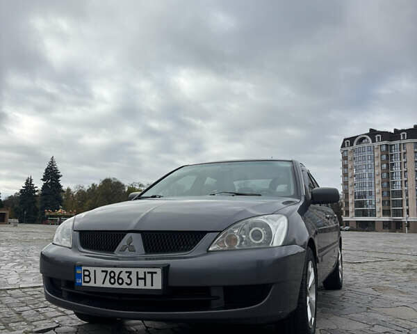 Серый Мицубиси Лансер, объемом двигателя 1.6 л и пробегом 222 тыс. км за 5200 $, фото 1 на Automoto.ua