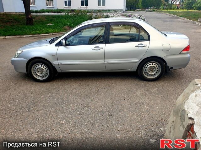 Серый Мицубиси Лансер, объемом двигателя 1.6 л и пробегом 98 тыс. км за 6200 $, фото 1 на Automoto.ua