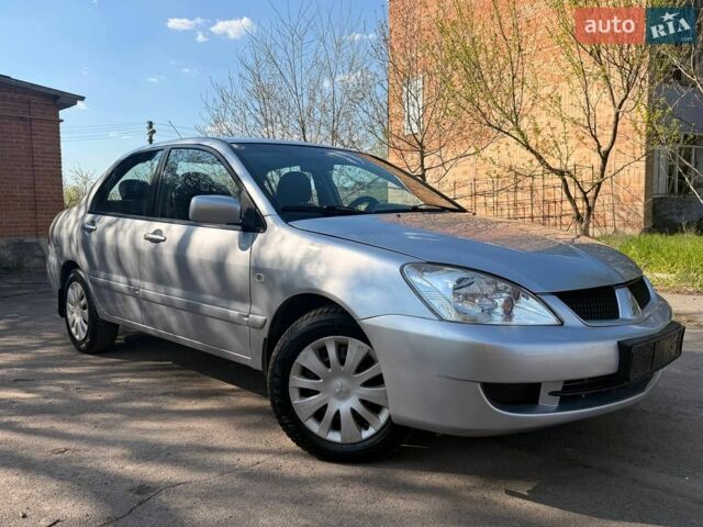 Сірий Міцубісі Lancer, об'ємом двигуна 1.58 л та пробігом 170 тис. км за 4750 $, фото 1 на Automoto.ua