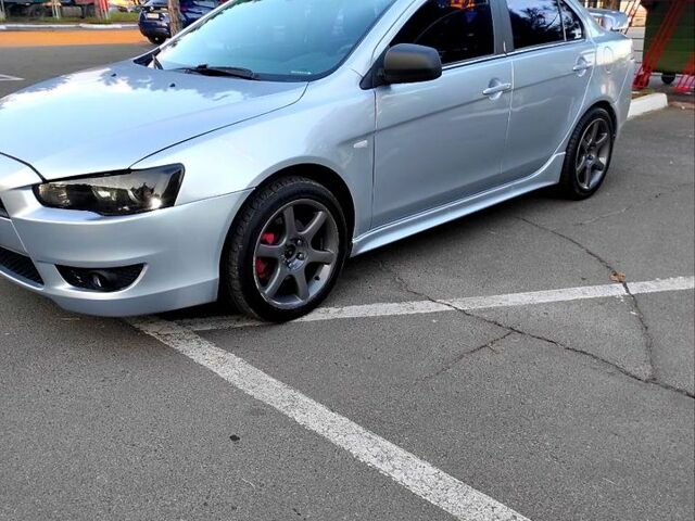 Серый Мицубиси Лансер, объемом двигателя 2 л и пробегом 226 тыс. км за 6999 $, фото 1 на Automoto.ua